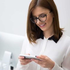 Portrait of beautiful businesswoman using smartphone