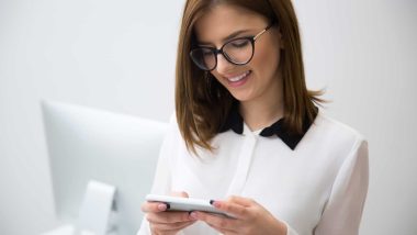 Portrait of beautiful businesswoman using smartphone